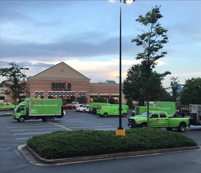 SERVPRO trucks in front of a commercial damage job