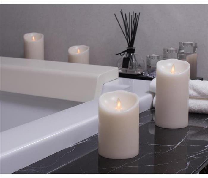 candle in bathroom on the bath tub
